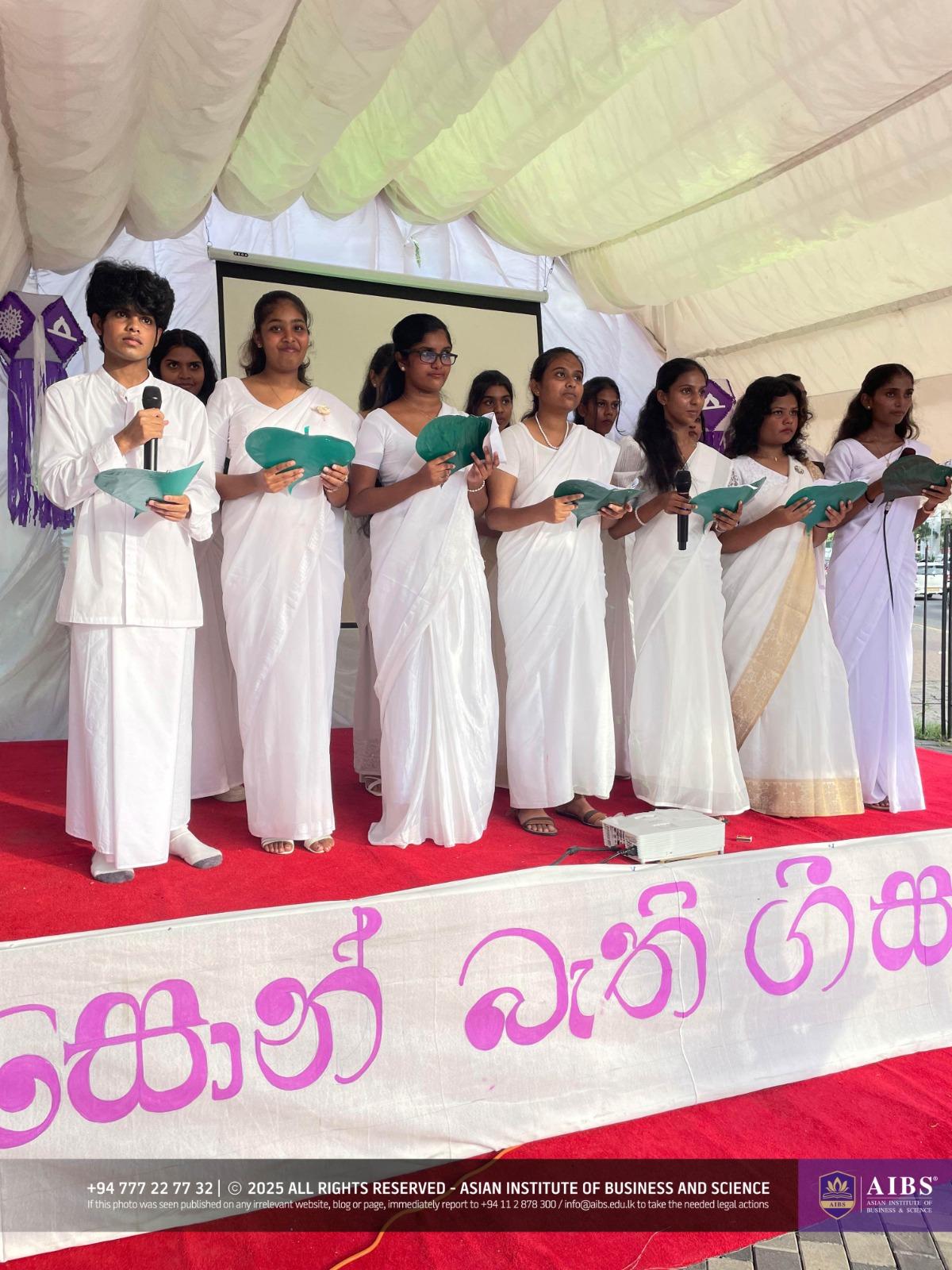 A Night of Light and Giving: Poson Celebrations at AIBS
