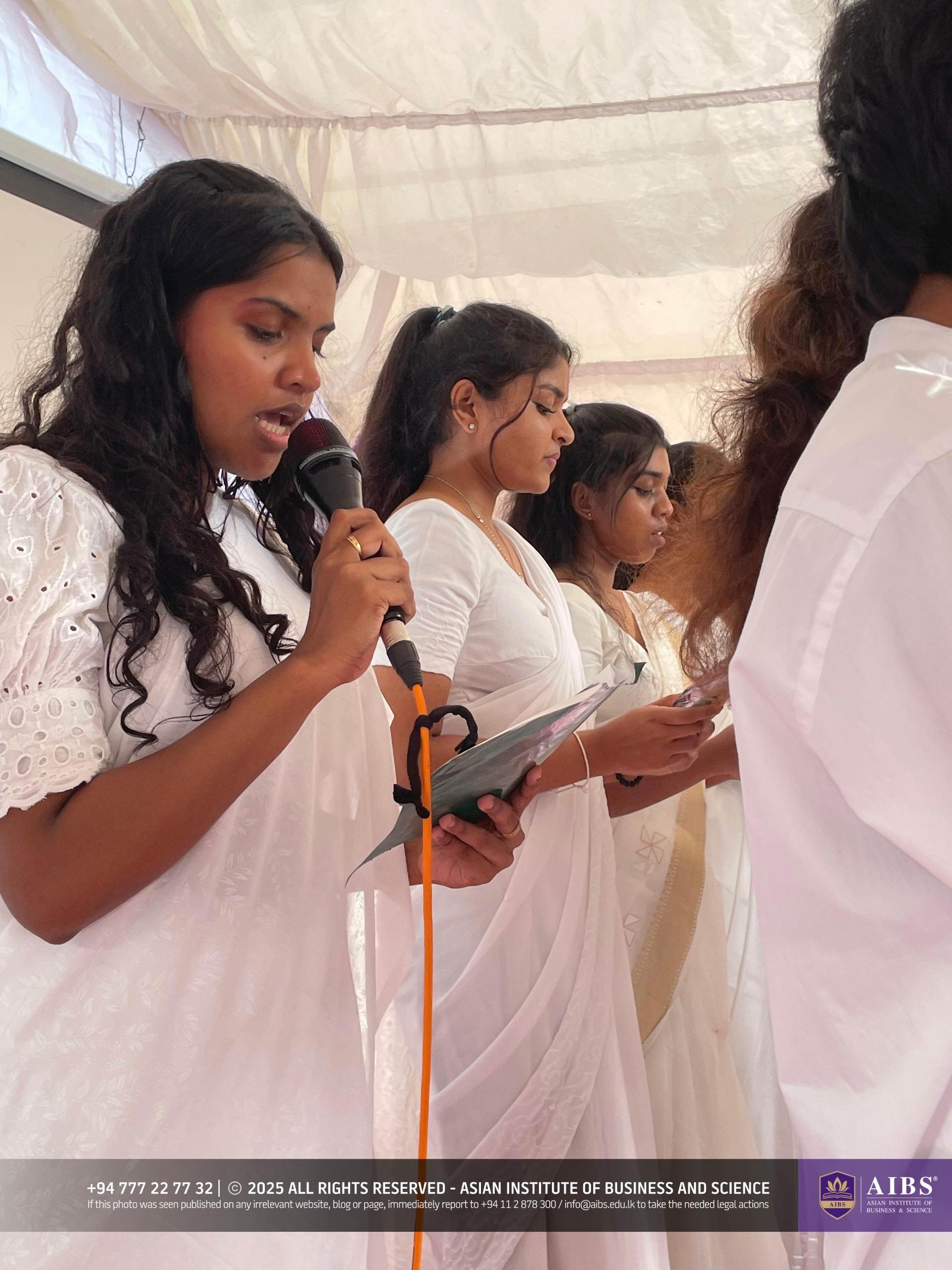 A Night of Light and Giving: Poson Celebrations at AIBS