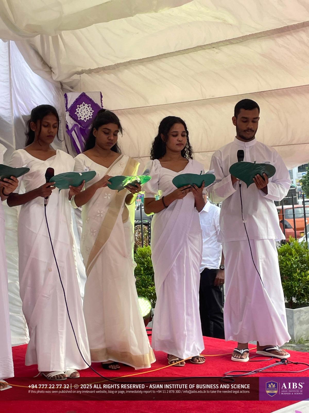 A Night of Light and Giving: Poson Celebrations at AIBS