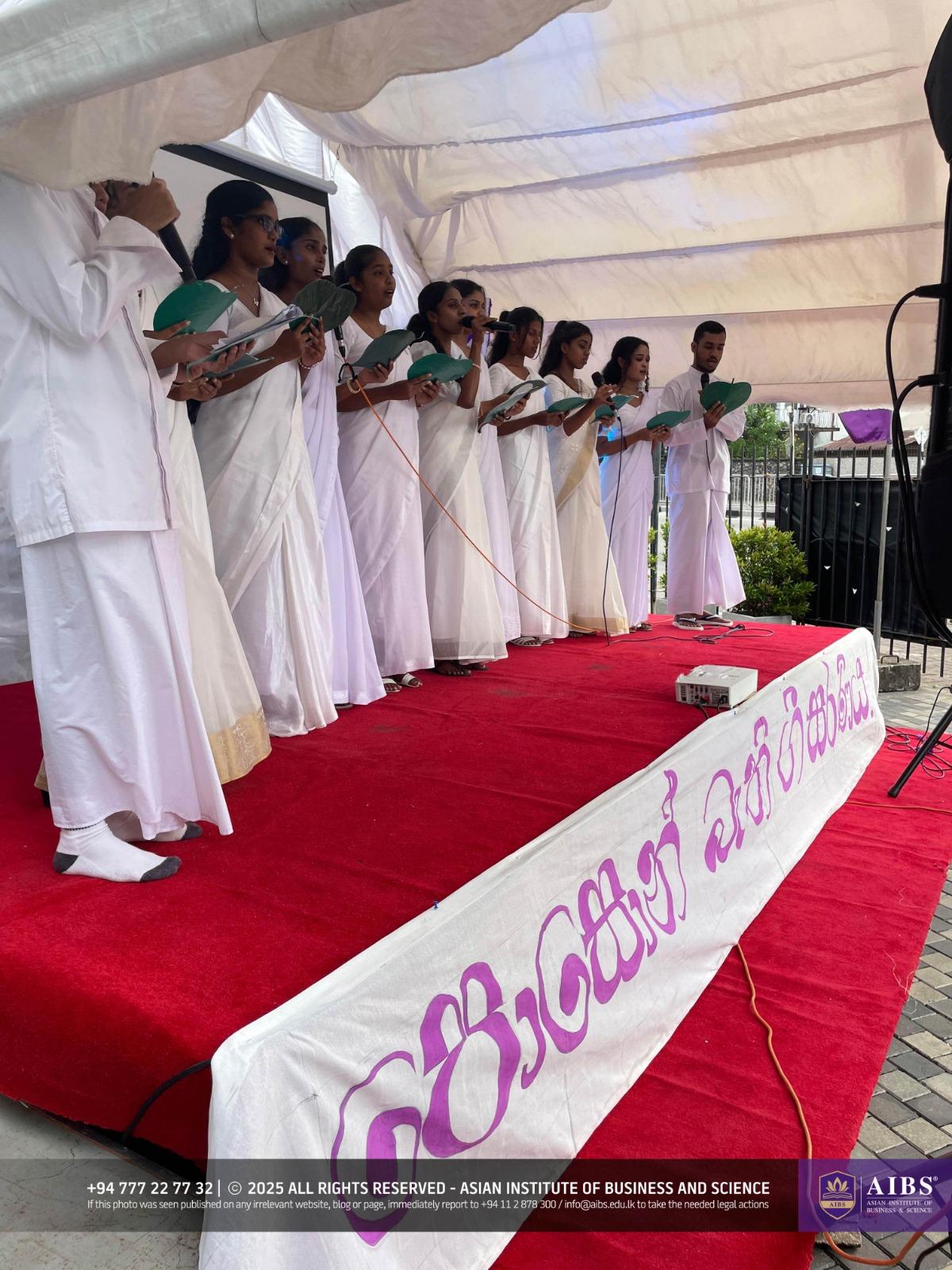 A Night of Light and Giving: Poson Celebrations at AIBS