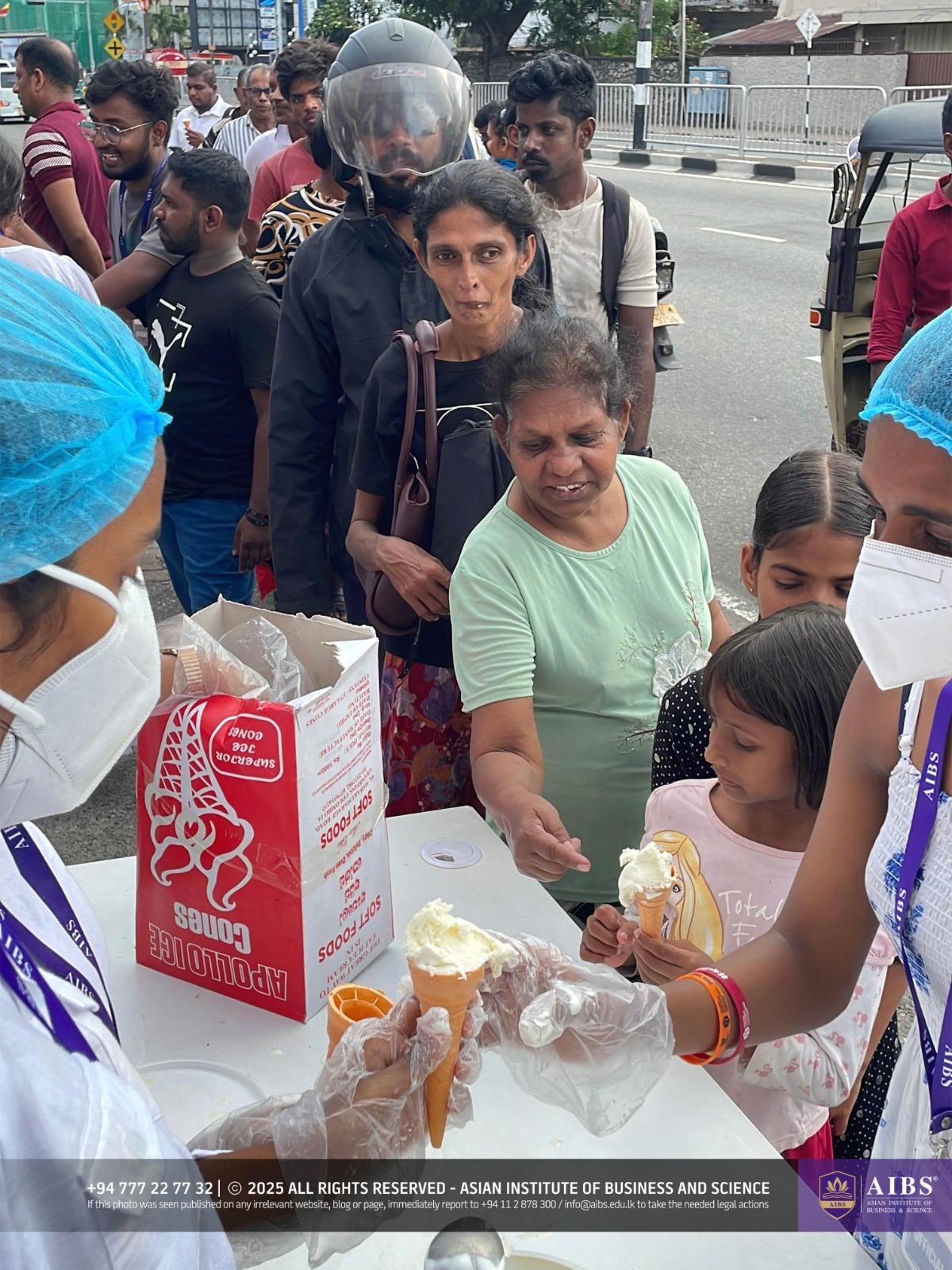 A Night of Light and Giving: Poson Celebrations at AIBS