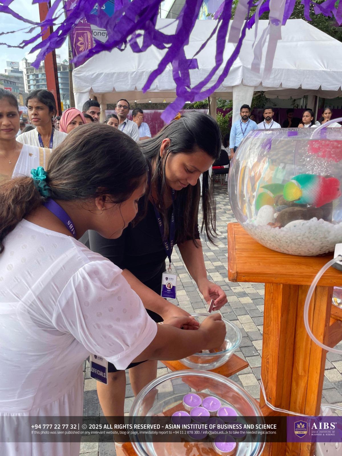 A Night of Light and Giving: Poson Celebrations at AIBS
