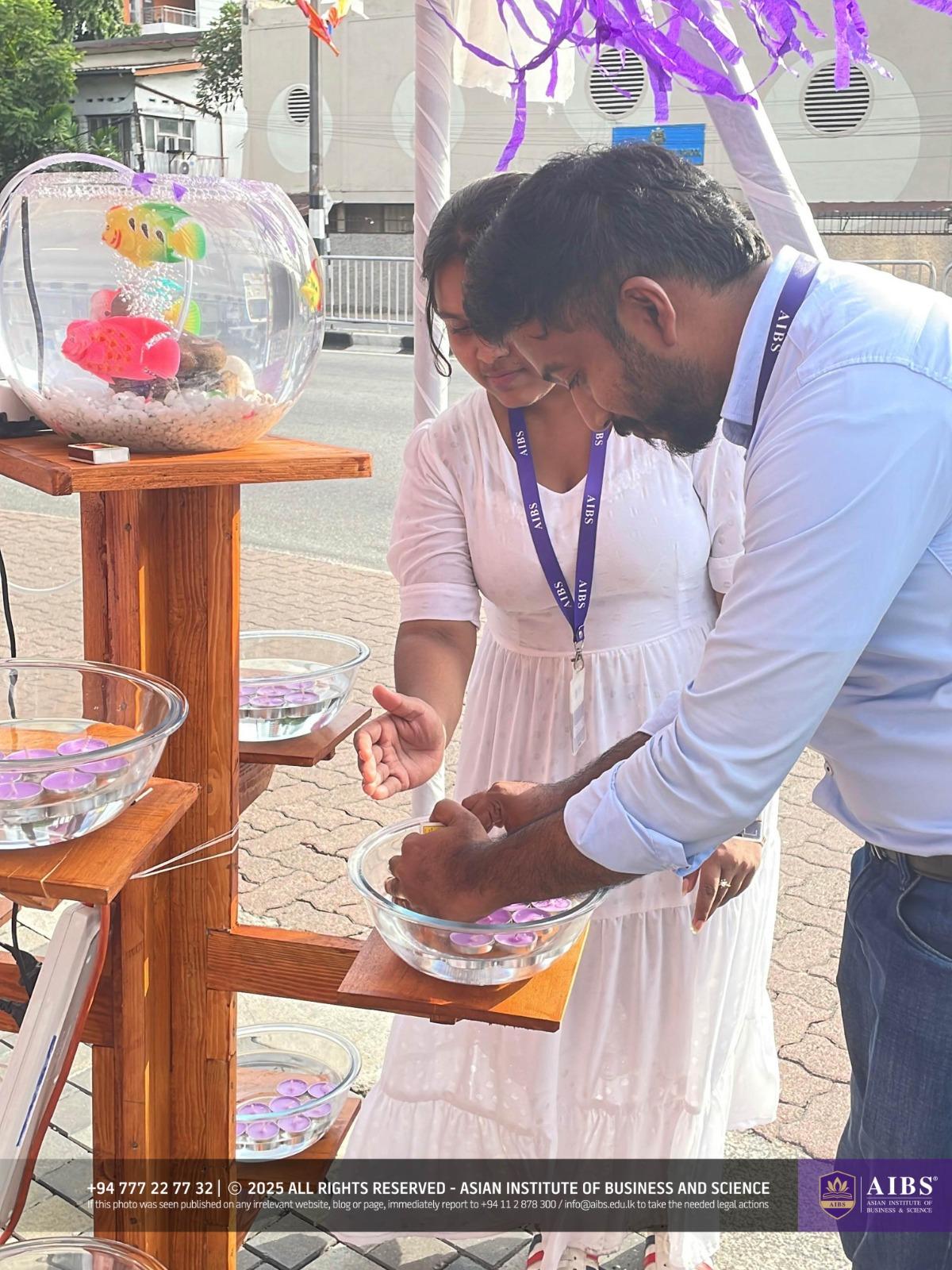 A Night of Light and Giving: Poson Celebrations at AIBS